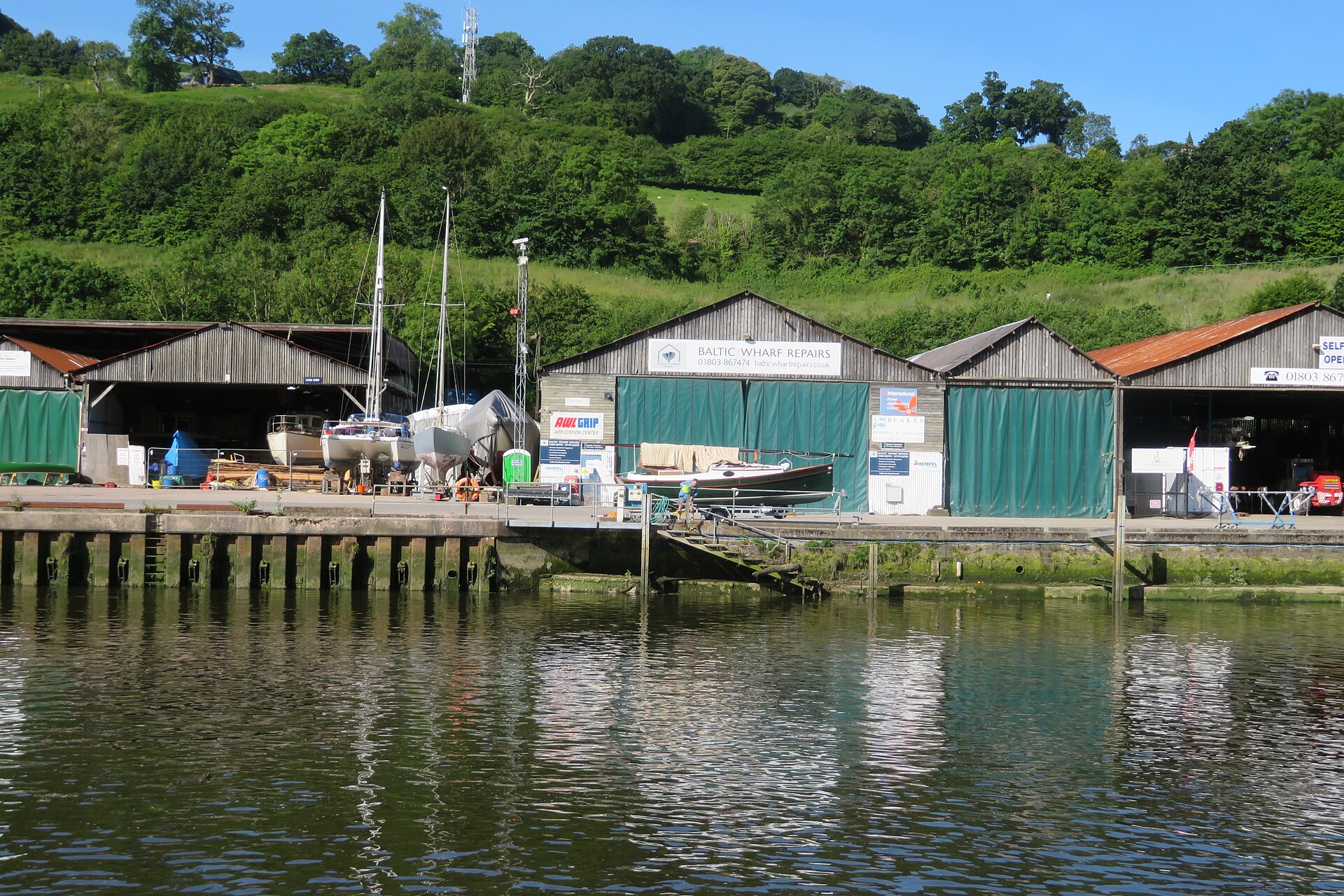 The yard sheds seen across the water
