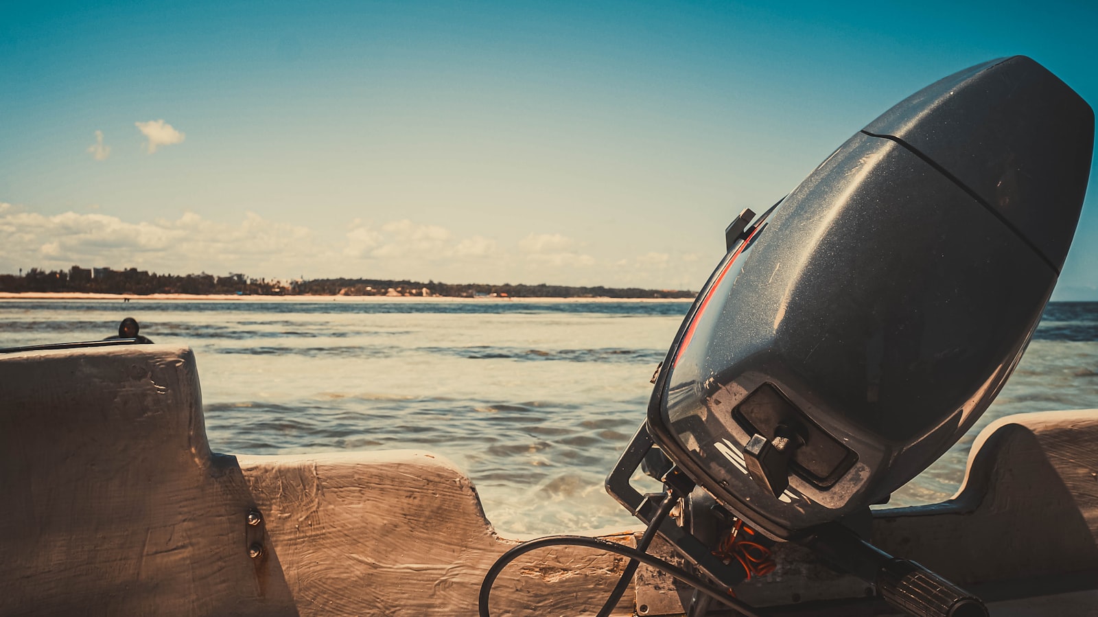 Outboard tilted clear of the water at dusk