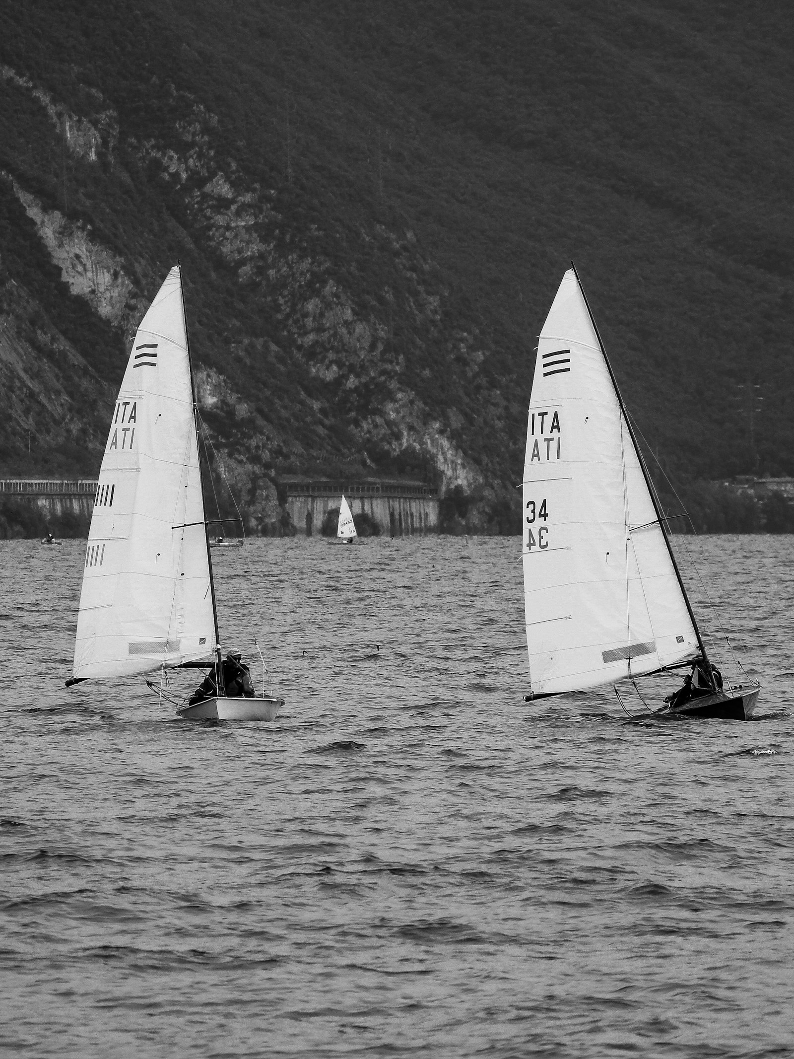 Two dinghies racing on open water